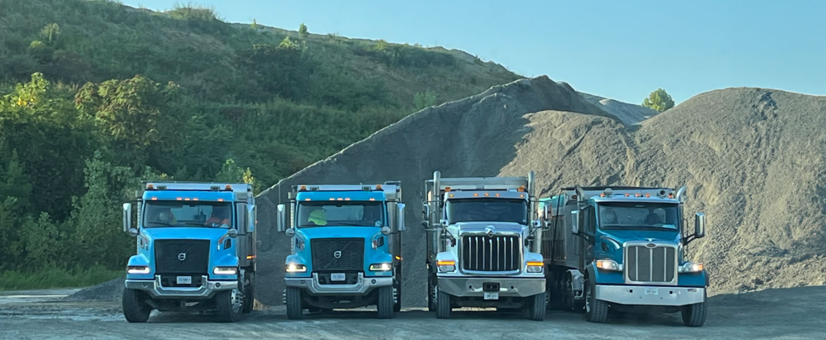 Four Dump Trucks